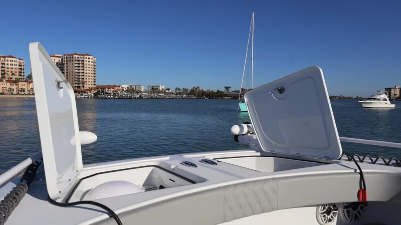 Slide: The Image of Freeman 47 boat deck with open hatches, 2021 model, on calm water near cityscape. - 41