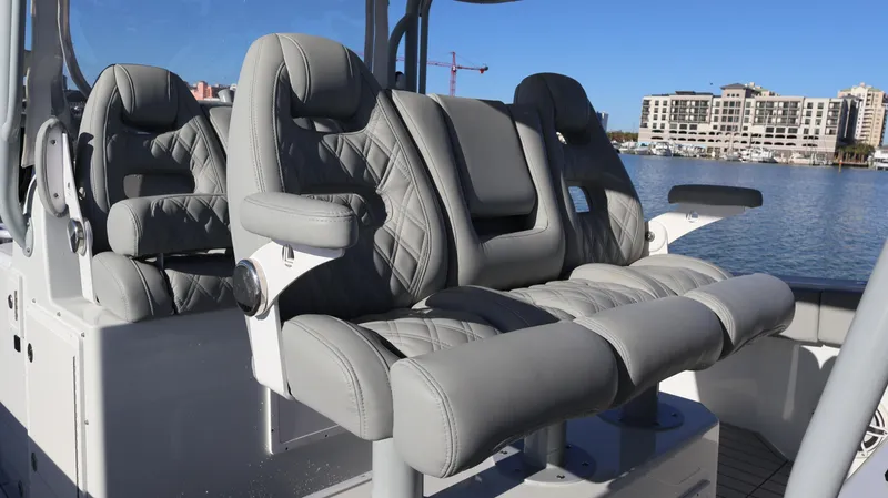 Slide: The Image of Luxury seating on a 2021 Freeman 47 boat, featuring gray quilted upholstery. - 43