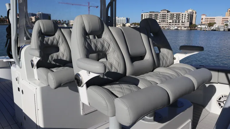 Slide: The Image of Luxury seating on a 2021 Freeman 47 boat, featuring quilted gray upholstery. - 44