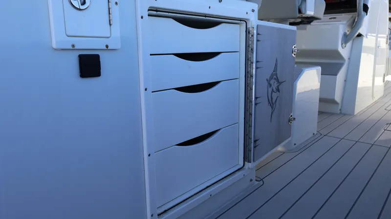 Slide: The Image of Freeman 47 boat storage compartments, 2021 model, featuring sleek design and efficient organization. - 45