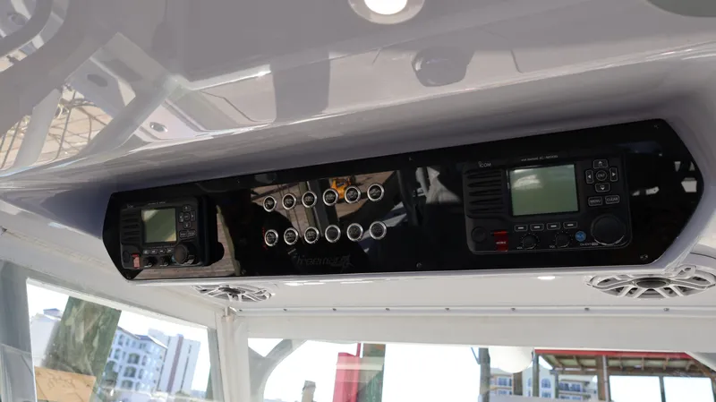 Slide: The Image of Control panel of a 2021 Freeman 47 boat with electronic displays and switches. - 46
