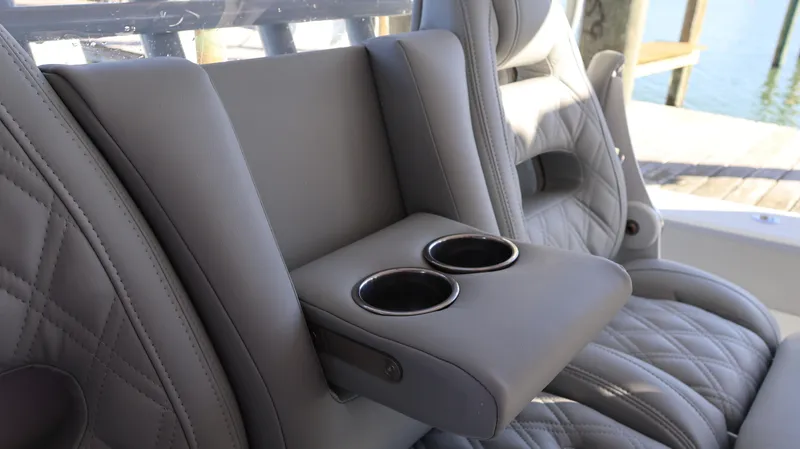 Slide: The Image of Luxurious Freeman 47 boat seating with cup holders, 2021 model, featuring quilted leather design. - 48