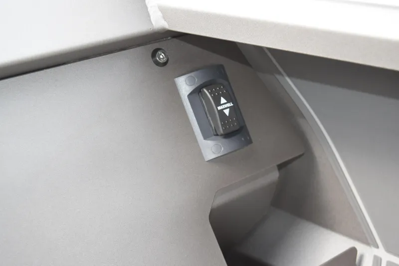 Slide: The Image of Control panel inside 2026 Stabicraft 1850 Supercab Sportfish boat, featuring a Maxwell switch. - 12