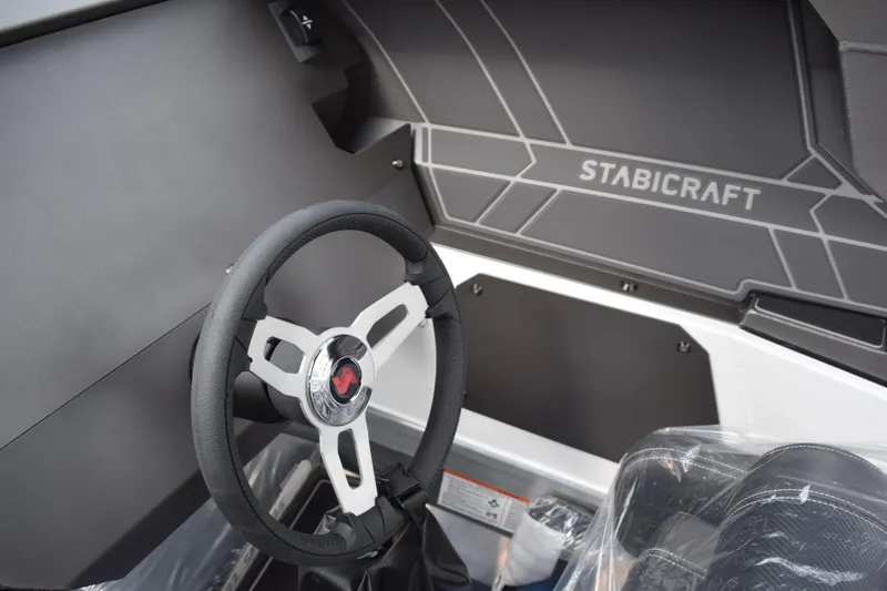Slide: The Image of Steering wheel of 2026 Stabicraft 1850 Supercab Sportfish boat interior. - 13