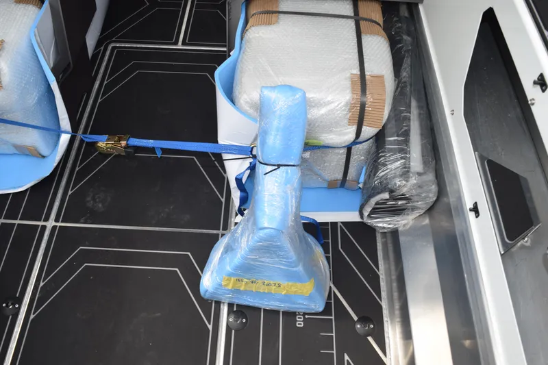 Slide: The Image of 2026 Stabicraft 1850 Supercab Sportfish interior with secured, wrapped seats and equipment. - 23