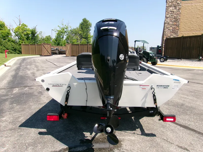 Slide: The Image of 2025 Tracker Pro Team 175 Crappie Edition boat with Mercury outboard motor, rear view. - 2