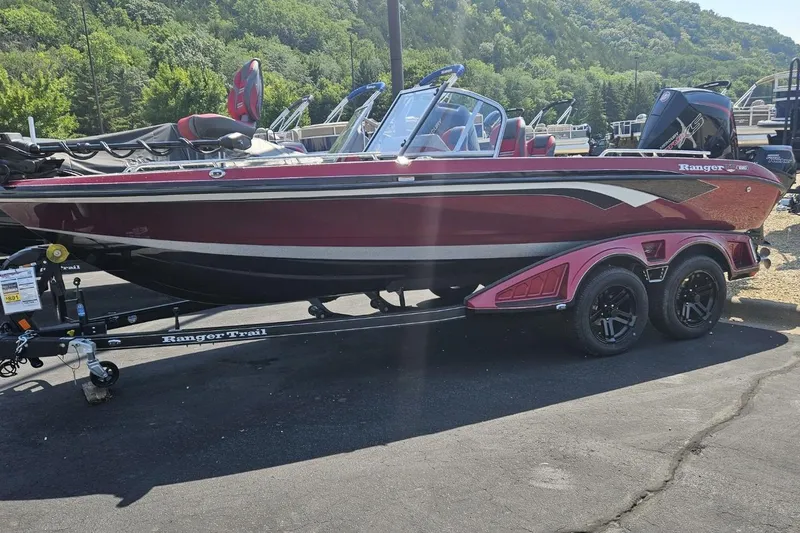 The Image of 2025 Ranger 620FS Cup Equipped boat on trailer, parked outdoors. - 0