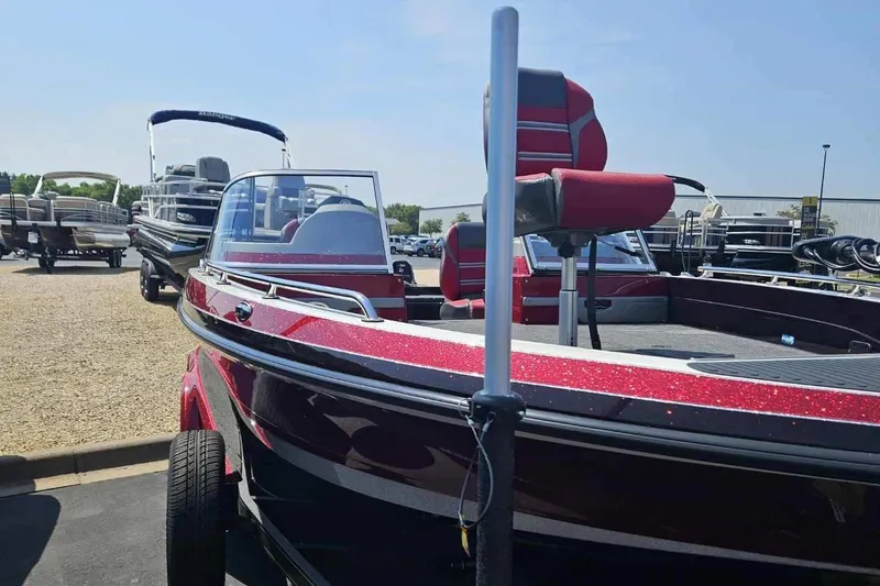 Slide: The Image of 2025 Ranger 620FS Cup Equipped boat in showroom, featuring sleek design and vibrant red color. - 2