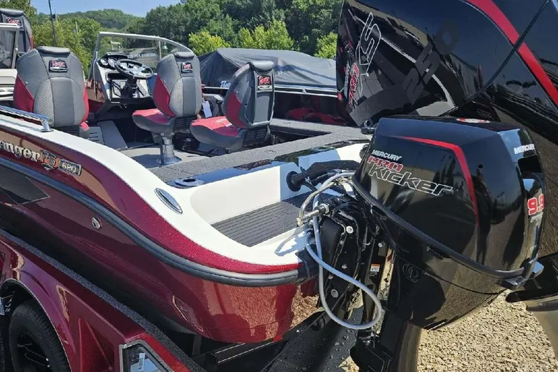 Slide: The Image of 2025 Ranger 620FS Cup Equipped boat with Mercury Pro Kicker engine, red and black interior. - 5