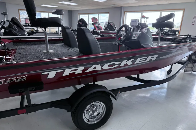 The Image of 2025 Tracker Pro Team 175 boat displayed indoors, featuring sleek design and comfortable seating. - 0