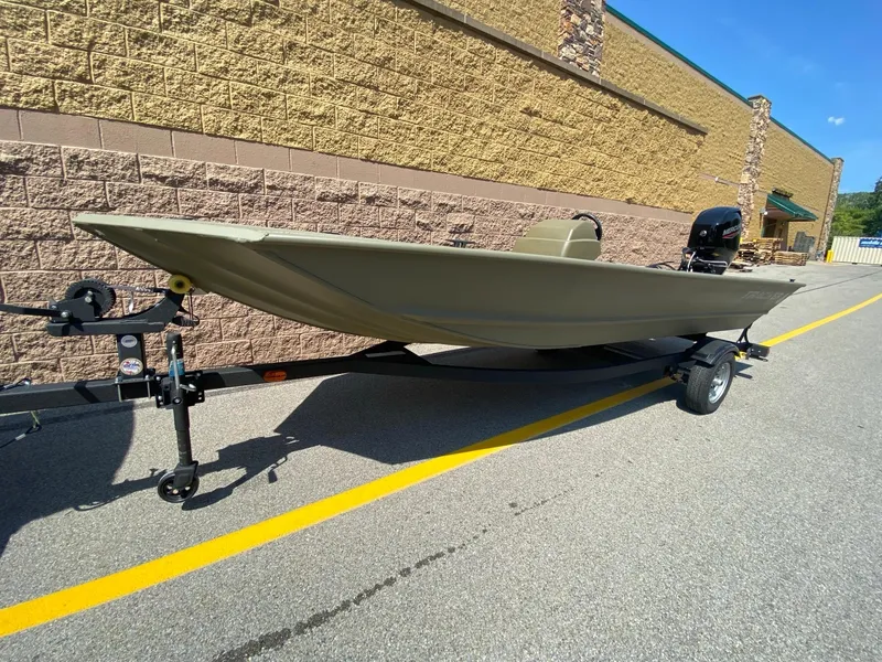 The Image of 2024 Tracker Grizzly 1648 SC boat on trailer, parked outdoors. - 0