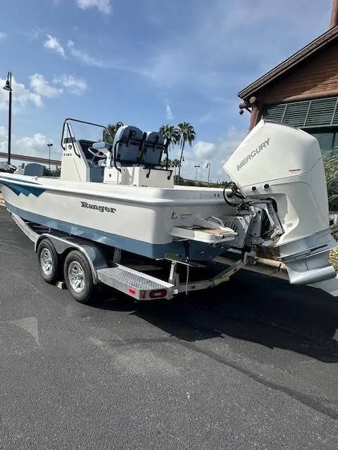 Slide: The Image of 2025 Ranger 2360 Bay boat on trailer with Mercury outboard engine. - 4