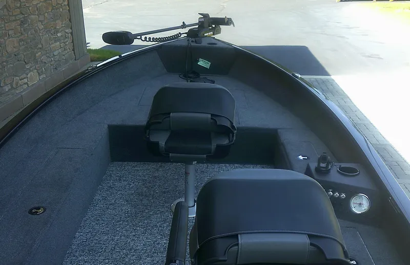 Slide: The Image of 2025 Tracker Super Guide V-16 T boat interior with seating and control panel. - 5