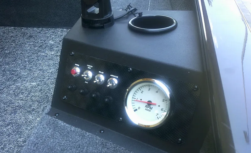 Slide: The Image of Control panel of 2025 Tracker Super Guide V-16 T with RPM gauge and switches. - 6