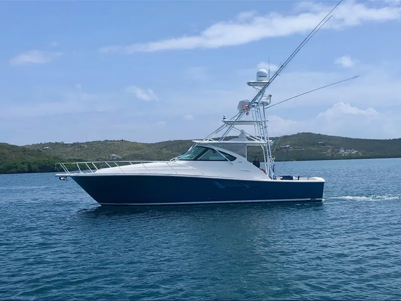 The Image of 2020 Tiara Yachts 43 Open cruising on calm waters under a clear sky. - 0