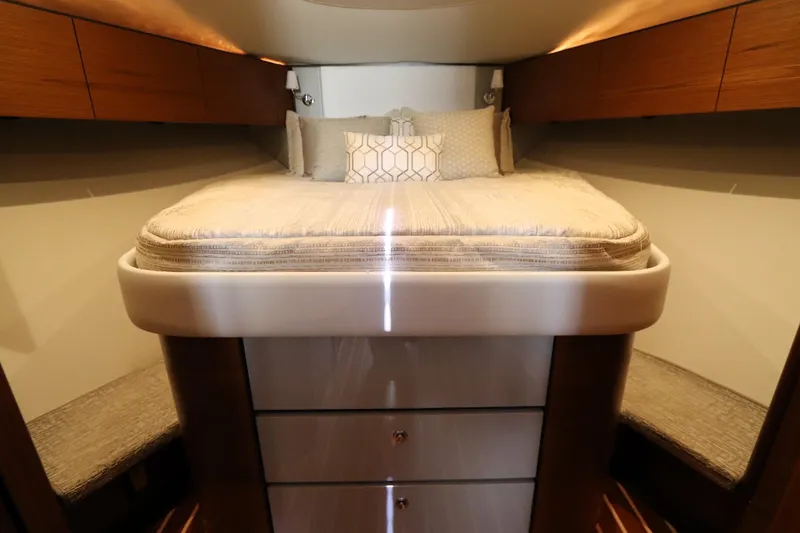 Slide: The Image of Luxurious cabin interior of 2020 Tiara Yachts 43 Open with elegant bedding and wood accents. - 14