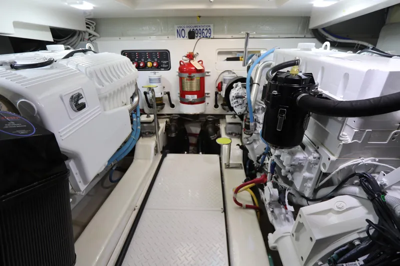 Slide: The Image of Engine room of 2020 Tiara Yachts 43 Open, featuring dual engines and safety equipment. - 19
