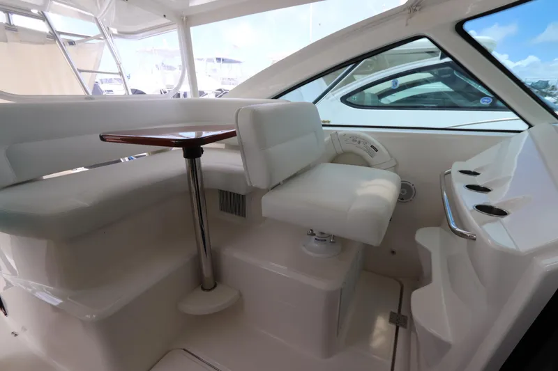 Slide: The Image of 2020 Tiara Yachts 43 Open interior with white seating and table. - 2