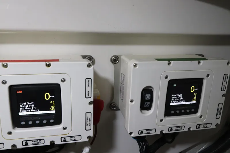 Slide: The Image of Engine control panels on a 2020 Tiara Yachts 43 Open, displaying fuel and engine data. - 24