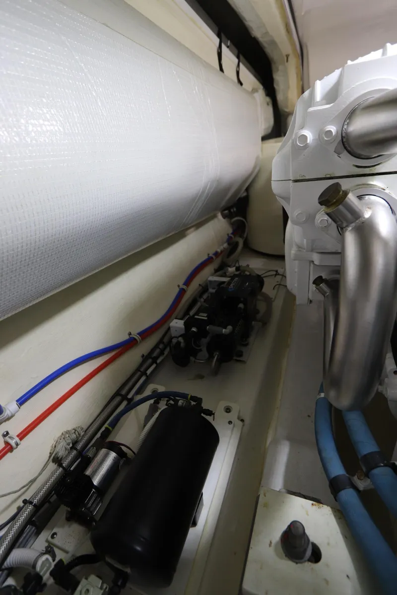 Slide: The Image of Engine room of 2020 Tiara Yachts 43 Open, showcasing pipes and mechanical components. - 26