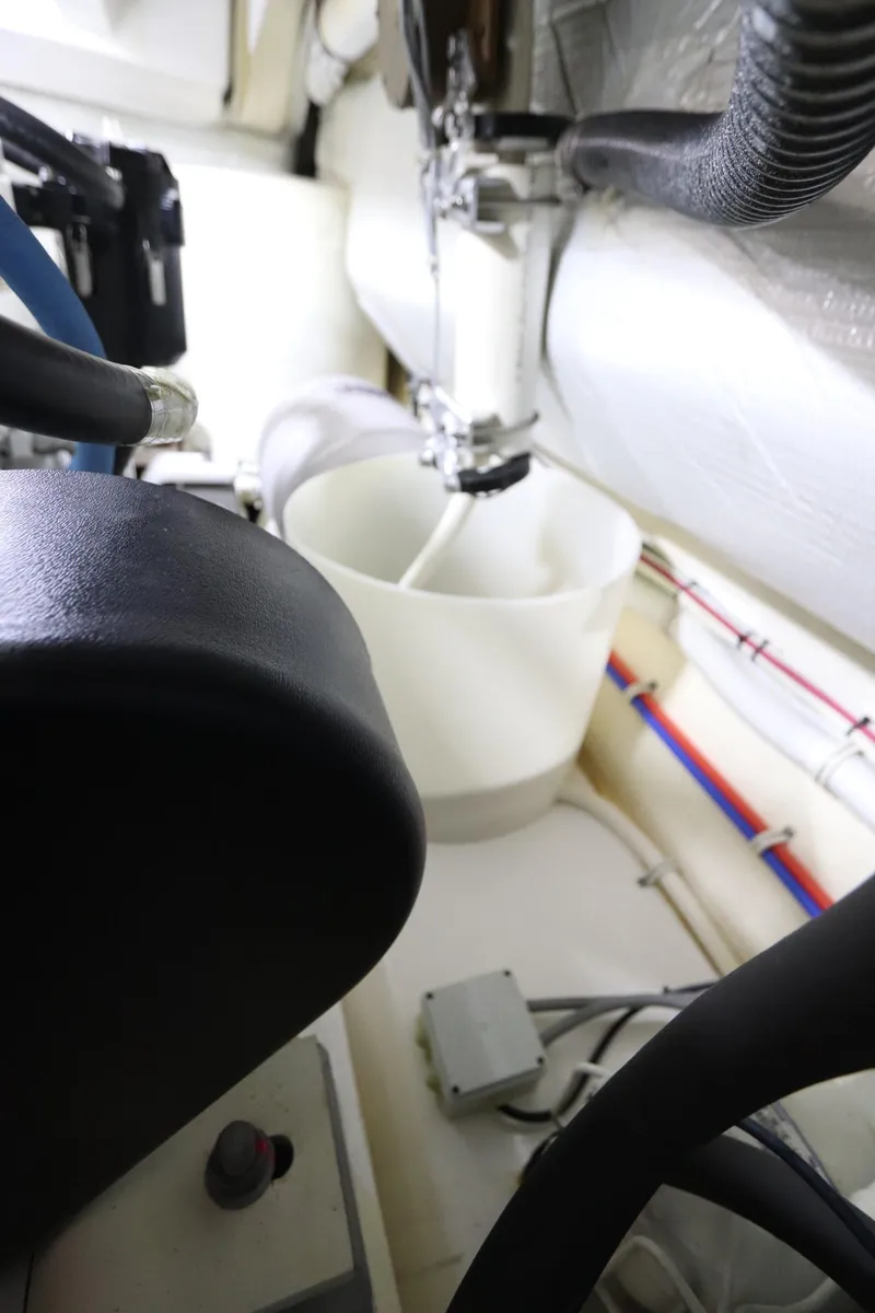 Slide: The Image of Engine room of 2020 Tiara Yachts 43 Open, showcasing mechanical components and piping. - 27