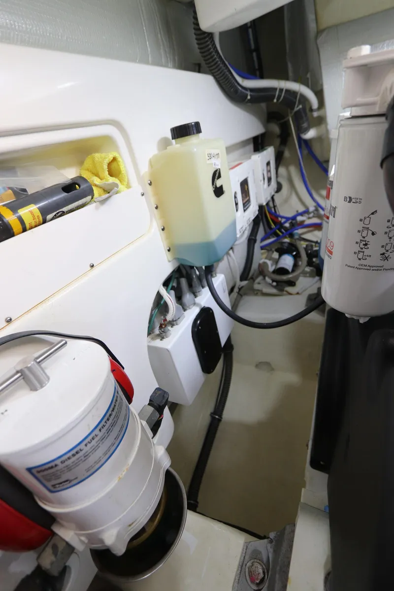 Slide: The Image of Engine room of 2020 Tiara Yachts 43 Open, showcasing mechanical components and wiring. - 28