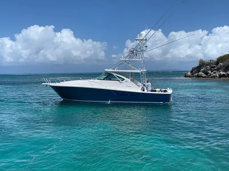 Slide: The Image of 2020 Tiara Yachts 43 Open in clear turquoise waters under a blue sky. - 31