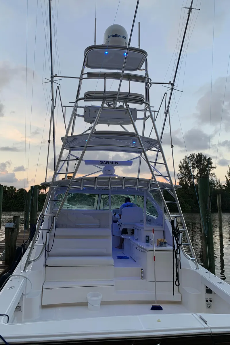 Slide: The Image of 2020 Tiara Yachts 43 Open at dock, featuring advanced navigation equipment and spacious deck. - 38