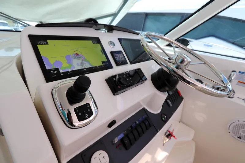 Slide: The Image of Helm of 2020 Tiara Yachts 43 Open with navigation display and controls. - 4
