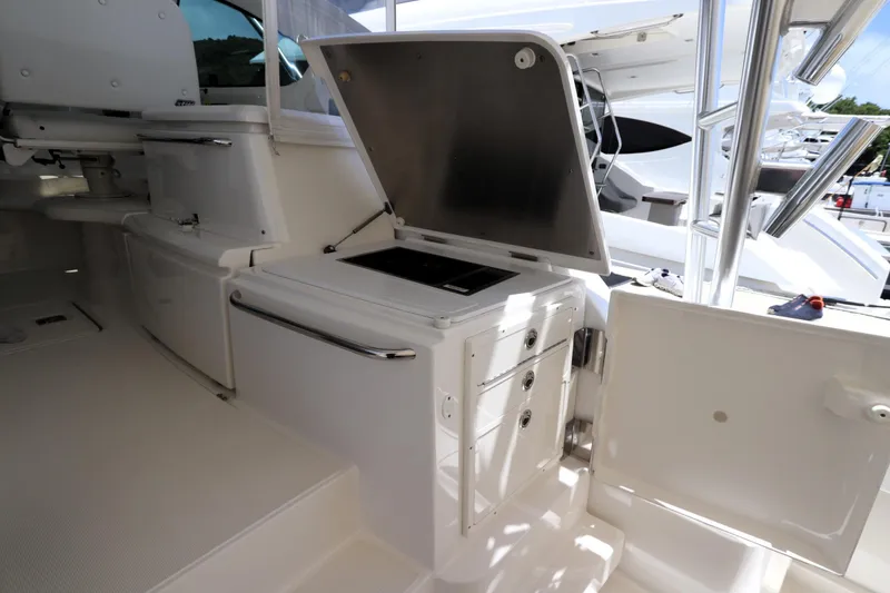 Slide: The Image of 2020 Tiara Yachts 43 Open interior with open storage compartments and sleek design. - 7