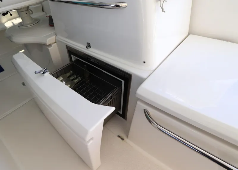 Slide: The Image of 2020 Tiara Yachts 43 Open interior with open fridge containing bottles. - 8