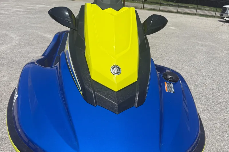 Slide: The Image of 2019 Yamaha WaveRunner EXR in blue and yellow, parked on gravel. - 6