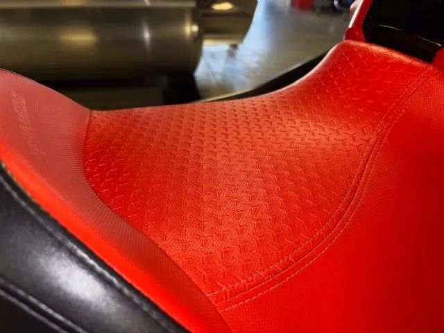 Slide: The Image of Red textured seat of a 2019 Sea-Doo RXTX watercraft. - 12