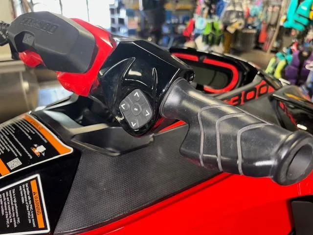 Slide: The Image of Close-up of 2019 Sea-Doo RXTX handlebar controls in a showroom setting. - 15