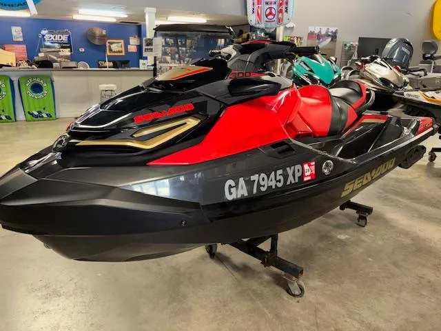 Slide: The Image of 2019 Sea-Doo RXTX jet ski in showroom, red and black design, registration GA 7945 XP. - 4