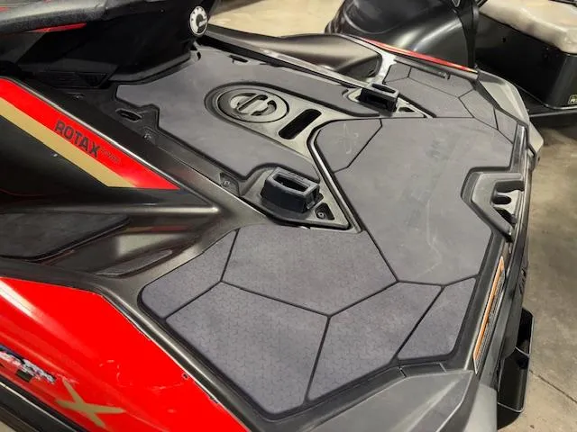 Slide: The Image of 2019 Sea-Doo RXTX jet ski with Rotax engine, featuring a sleek red and black design. - 8