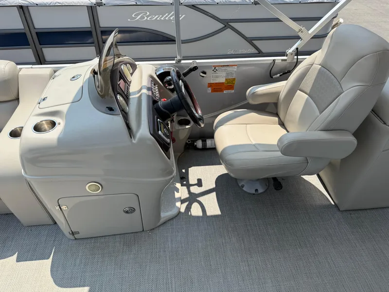 Slide: The Image of 2016 South Bay 521RS boat helm with captain's chair and control panel. - 10