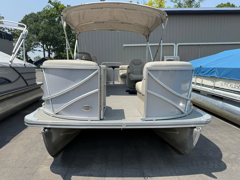 Slide: The Image of 2016 South Bay 521RS pontoon boat with canopy, docked outdoors. - 7
