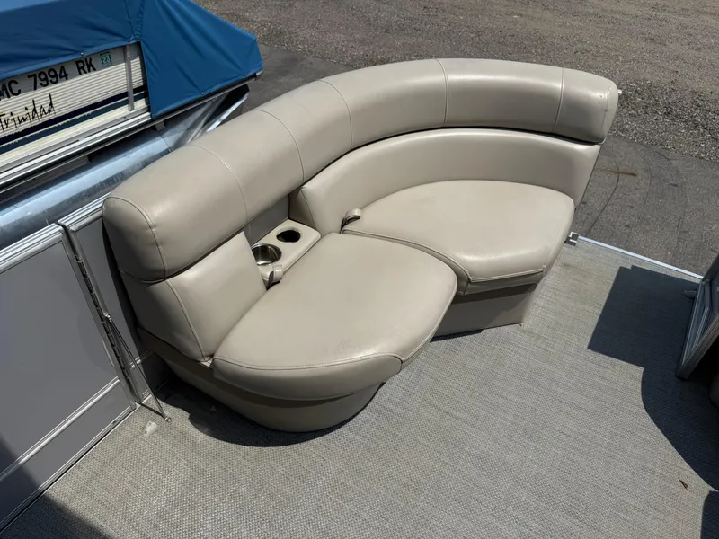 Slide: The Image of 2016 South Bay 521RS boat with beige curved seating and cup holders. - 9