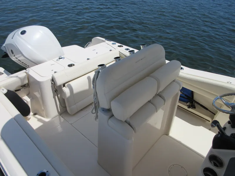 Slide: The Image of 2019 Grady-White Fisherman 236 boat interior with seating and Yamaha outboard motor. - 19