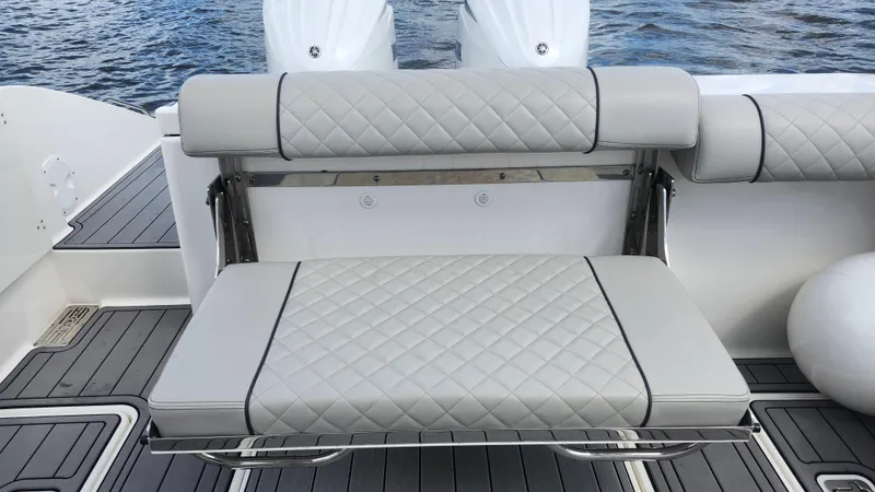 Slide: The Image of 2023 Pursuit OS 325 Offshore boat with cushioned seating and sleek design. - 41