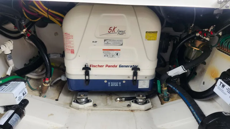 Slide: The Image of Fischer Panda generator in 2023 Pursuit OS 325 Offshore boat engine compartment. - 47