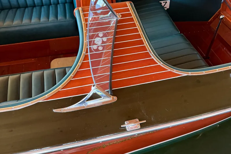 Slide: The Image of 1997 Hacker-Craft 26' Runabout with polished wood and leather seating. - 13