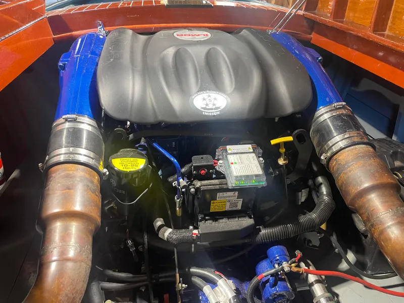 Slide: The Image of Engine of a 1997 Hacker-Craft 26' Runabout, showcasing detailed components and craftsmanship. - 25