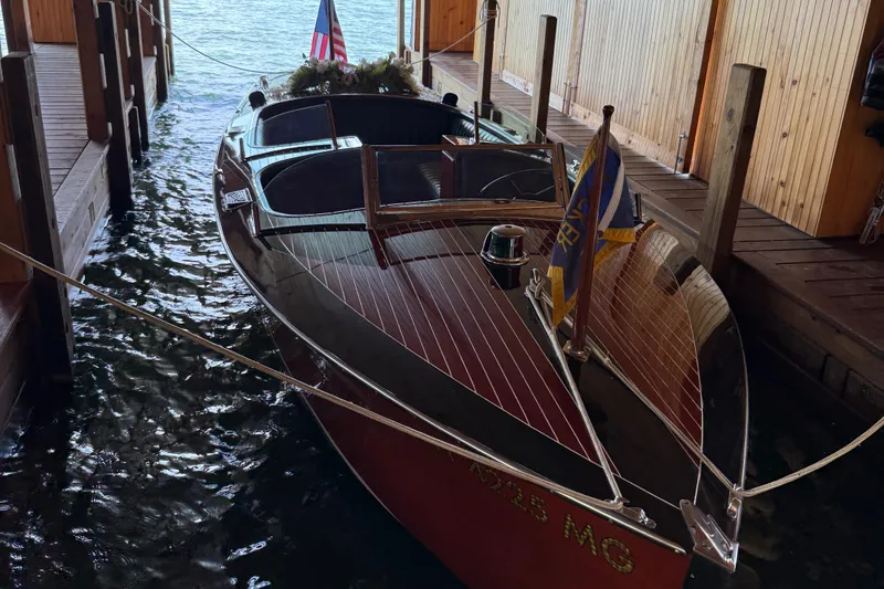 Slide: The Image of Classic 1997 Hacker-Craft 26' Runabout docked in wooden boathouse. - 3