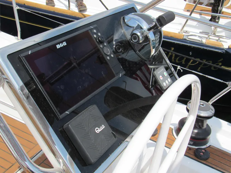 Slide: The Image of Steering console of 2020 Beneteau Oceanis 46.1 yacht with navigation equipment. - 19