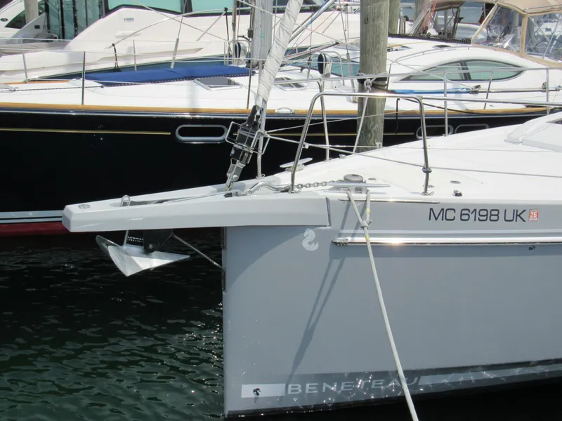 Slide: The Image of 2020 Beneteau Oceanis 46.1 sailboat docked, featuring sleek design and visible anchor. - 2
