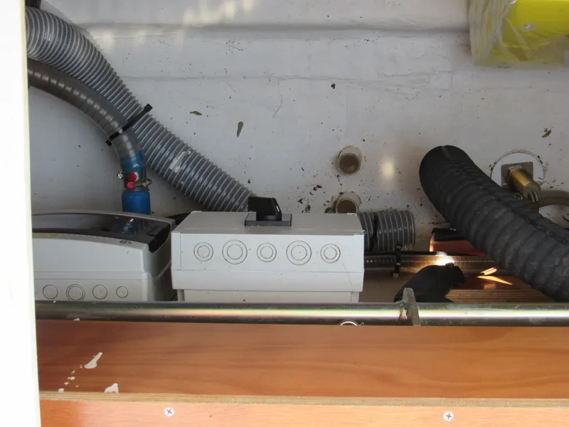 Slide: The Image of Electrical components and hoses inside a 2020 Beneteau Oceanis 46.1 yacht. - 25