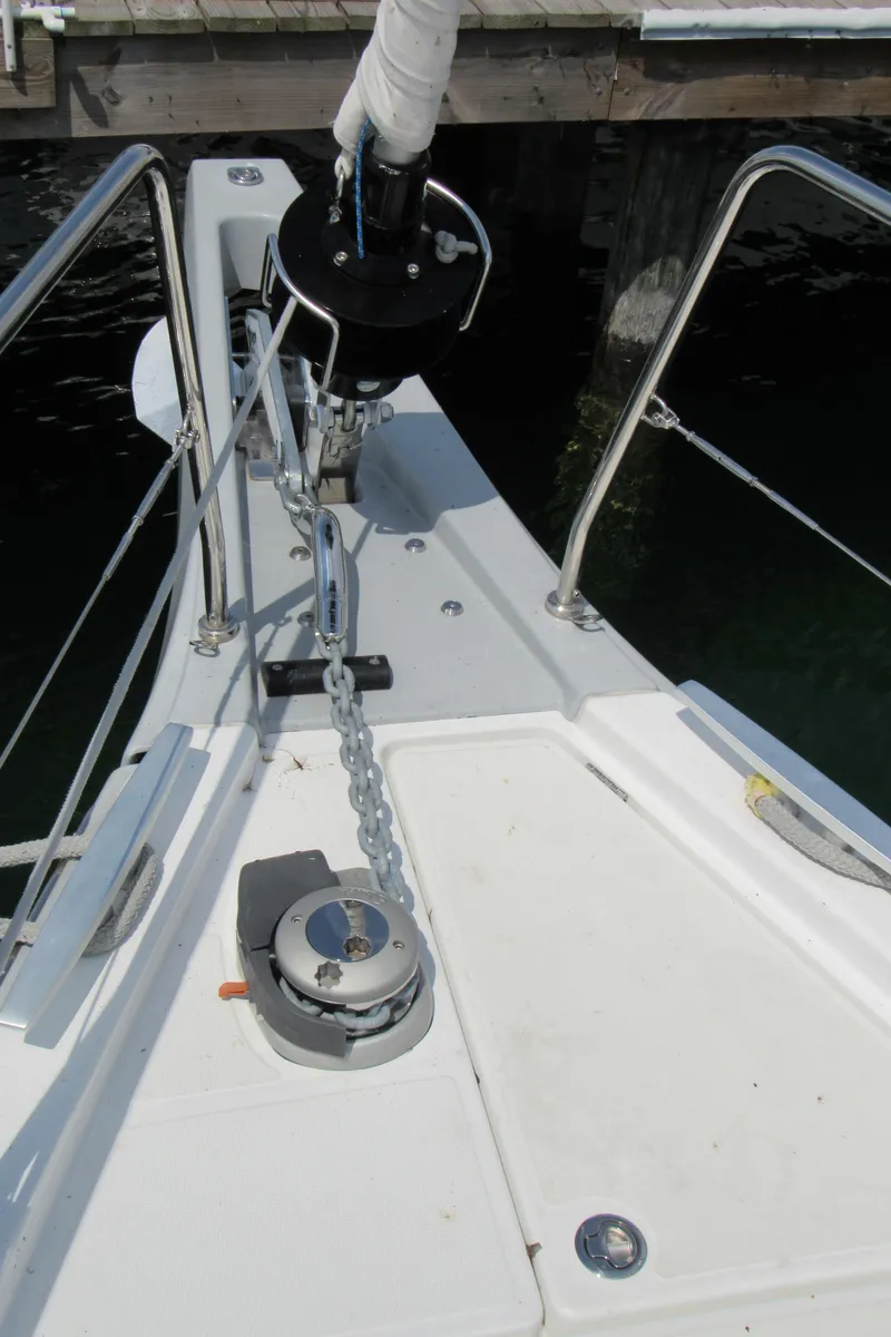Slide: The Image of Bow of 2020 Beneteau Oceanis 46.1 sailboat with anchor chain and winch. - 27