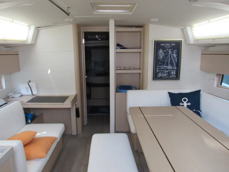Slide: The Image of Interior of 2020 Beneteau Oceanis 46.1 yacht with modern dining area and nautical decor. - 6